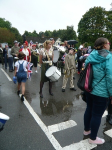 Band getting wet at the start of the procession